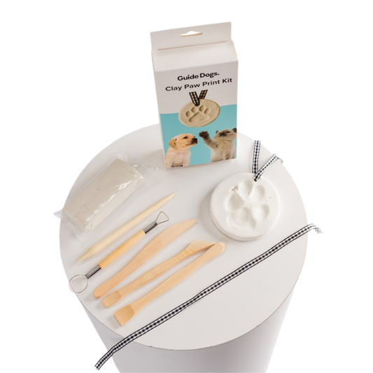 Image of a Clay Paw Print Kit, includes tools, clay, and ribbon.