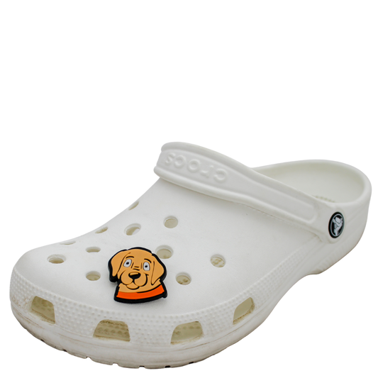 Image of a white clog shoe with a beige puppy face with orange collar Shoe Charm on the front.