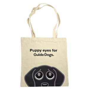Image of Tote Bag - Puppy Eyes: Soft cotton bag with cartoon puppy face and Guide Dogs text.