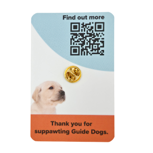 Image of an enamel pin with a puppy, a QR code, and text: Thank you for helping raise awareness for Guide Dogs.