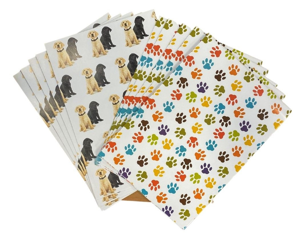 Image of Wrapping Paper: Puppies & Paws features black and gold dog design and multicoloured paw print design.