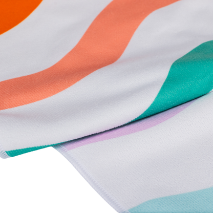 Image of a close-up of fabric with colorful abstract pattern on a white background