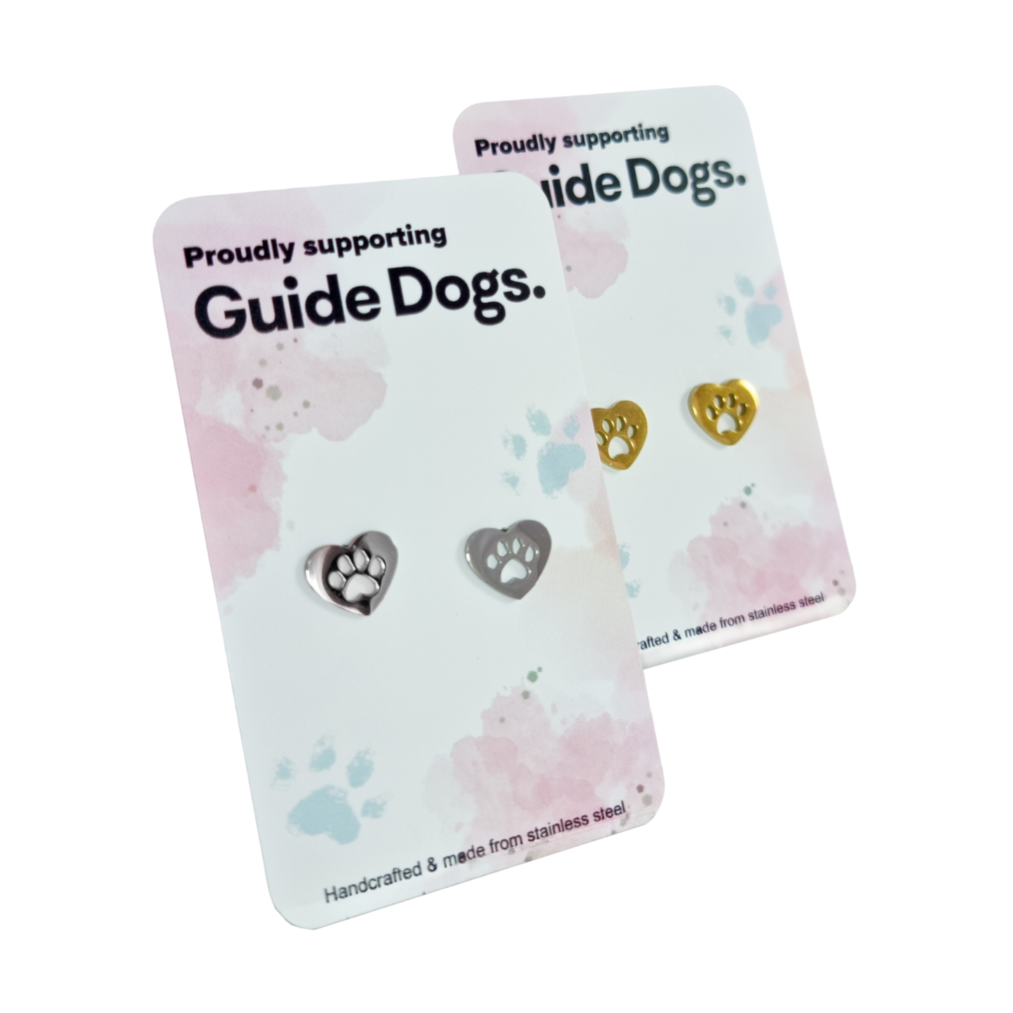 Image of Two pairs of heart stud earrings with paw prints on cards stating Proudly supporting Guide Dogs.