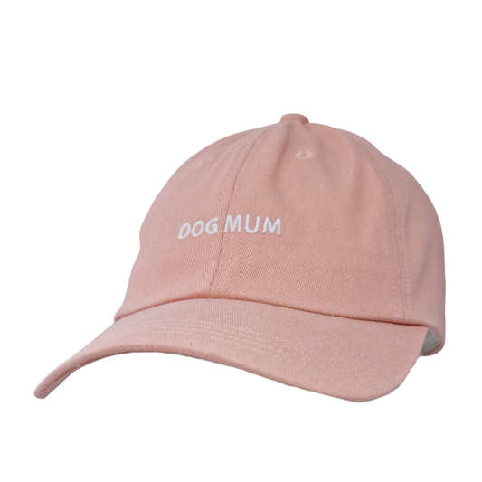 Image of Light pink Caps with white embroidered "Dog Mum"—the perfect accessory for dog lovers.