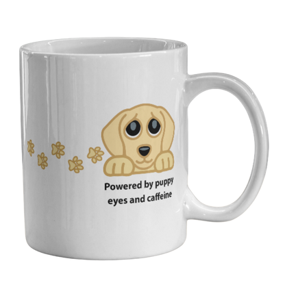 Image of a white ceramic coffee mug featuring a cartoon puppy graphic and the text 'Powered by puppy eyes and caffeine' on a plain white background.