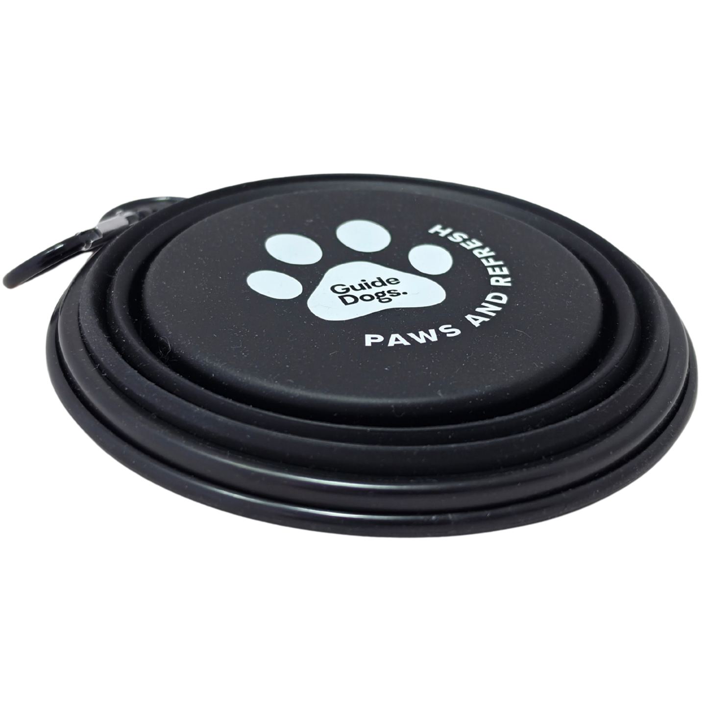 Image of a black collapsible dog water bowl with a carrying loop, featuring a white paw print logo and the text 'Guide Dogs' and 'PAWS AND REFRESH' on the base, shown on a white background.