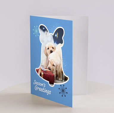 Image of a blue card with two yellow labs and "Season’s Greetings".