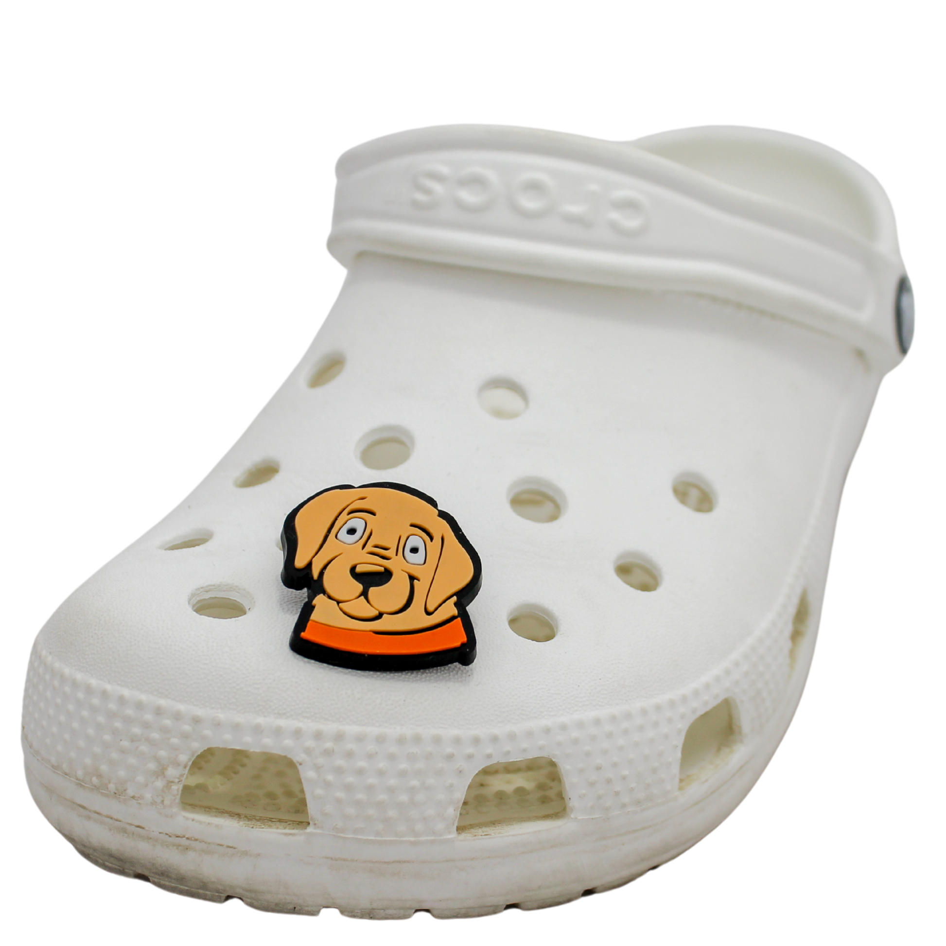 Image of a white clog shoe with a beige puppy face with orange collar Shoe Charm on the front.
