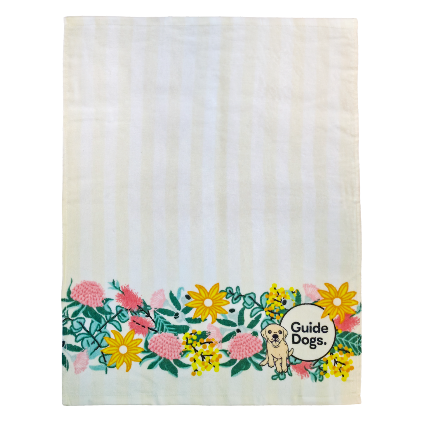 Image of a cream and white tea towel with  Guide Dogs logo and a dog illustration with floral elements on a white background.