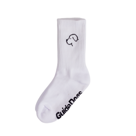 Image of a pair of white sock with black outline of a dog face on the ankle and Guide Dogs logo on the sole on a white background