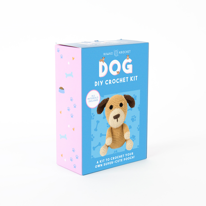 Image of a blue and pink box labeled "Crochet Kit" shows a crochet dog on the front. Made by Kawaii Krochet, this beginner kit has all materials needed to make a cute dog plush.