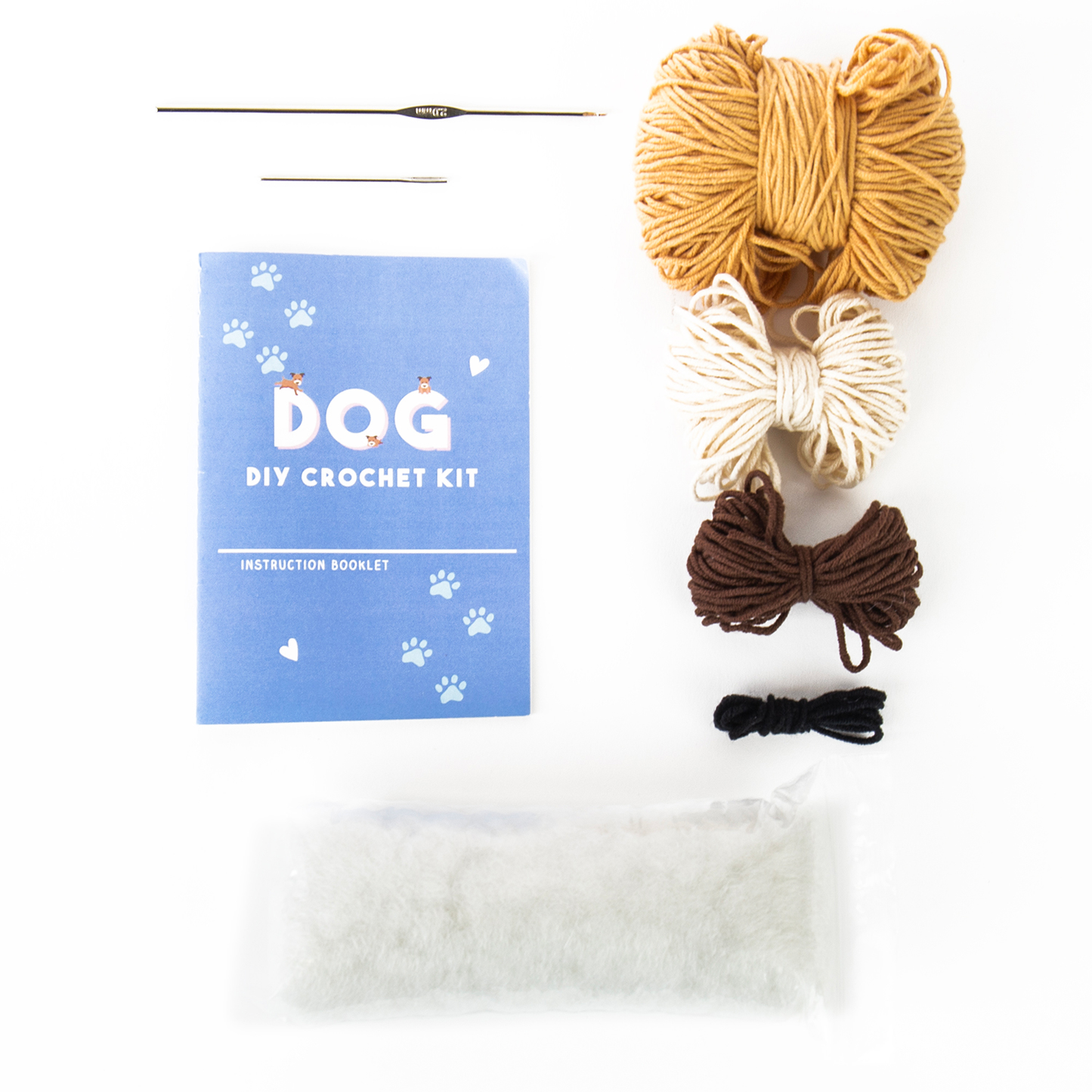 Image of Crochet Kit for beginners featuring brown, beige, dark brown, and black yarn, crochet hook, needle, instructions, and stuffing—organized on a white surface. The perfect DIY set for pet lovers.