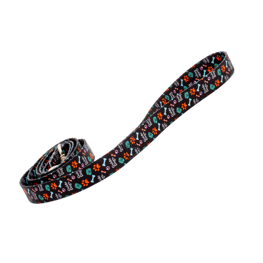 Image of dog leash with colorful bone and paw pattern on a black background