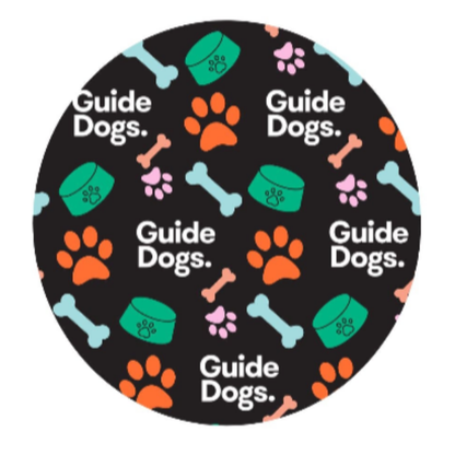 Round image with 'Guide Dogs' text and colorful paw prints, bones, and bowls on a black background