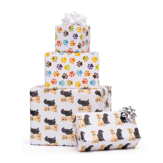 Image of three stacked gift boxes wrapped in Puppies & Paws paper, topped with shiny silver and white bows.