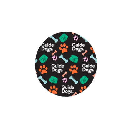 image of a black circle with 'Guide Dogs' text and paw print design on a white background.