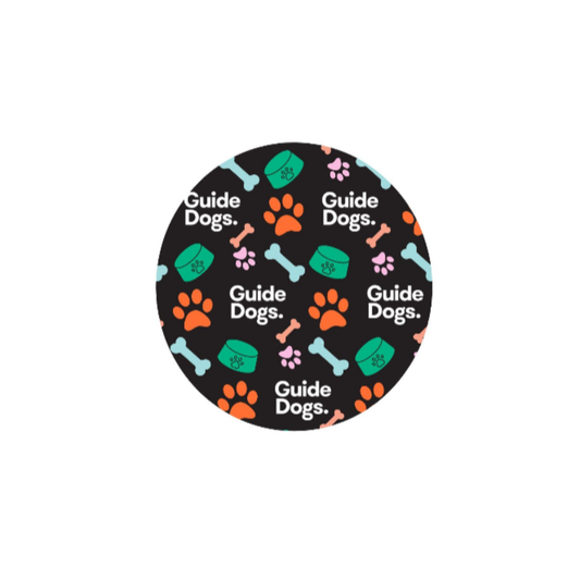 image of a black circle with 'Guide Dogs' text and paw print design on a white background.