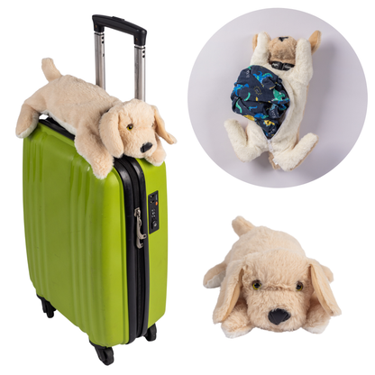 Image of a plush dog toy on a green suitcase with close-up inset showing the toy's face.